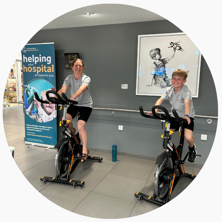 Kirsty and Kian Raising money on static bikes