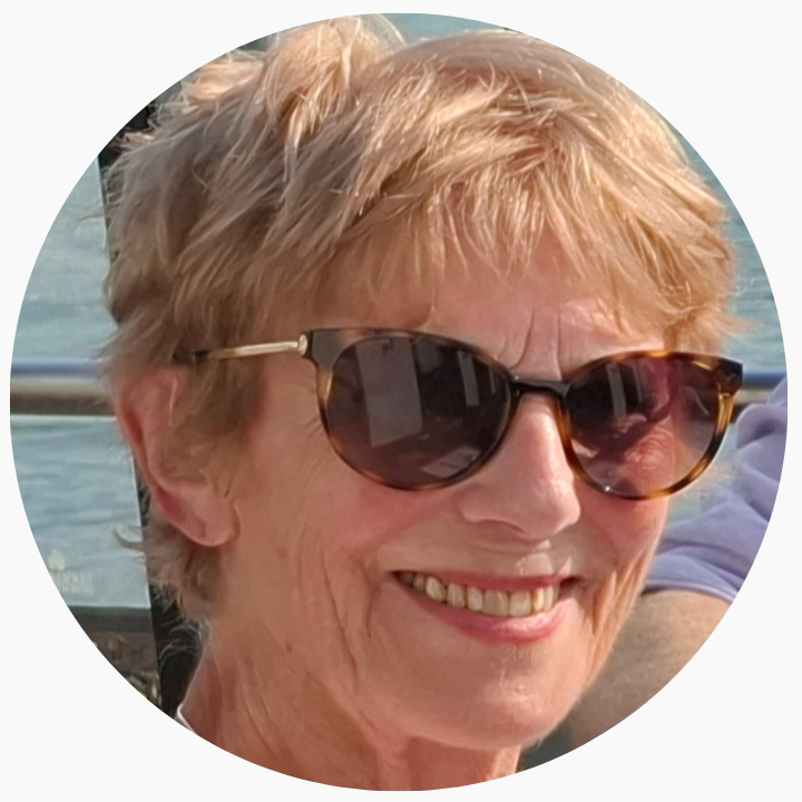 Lady smiling at camera with sunglasses on
